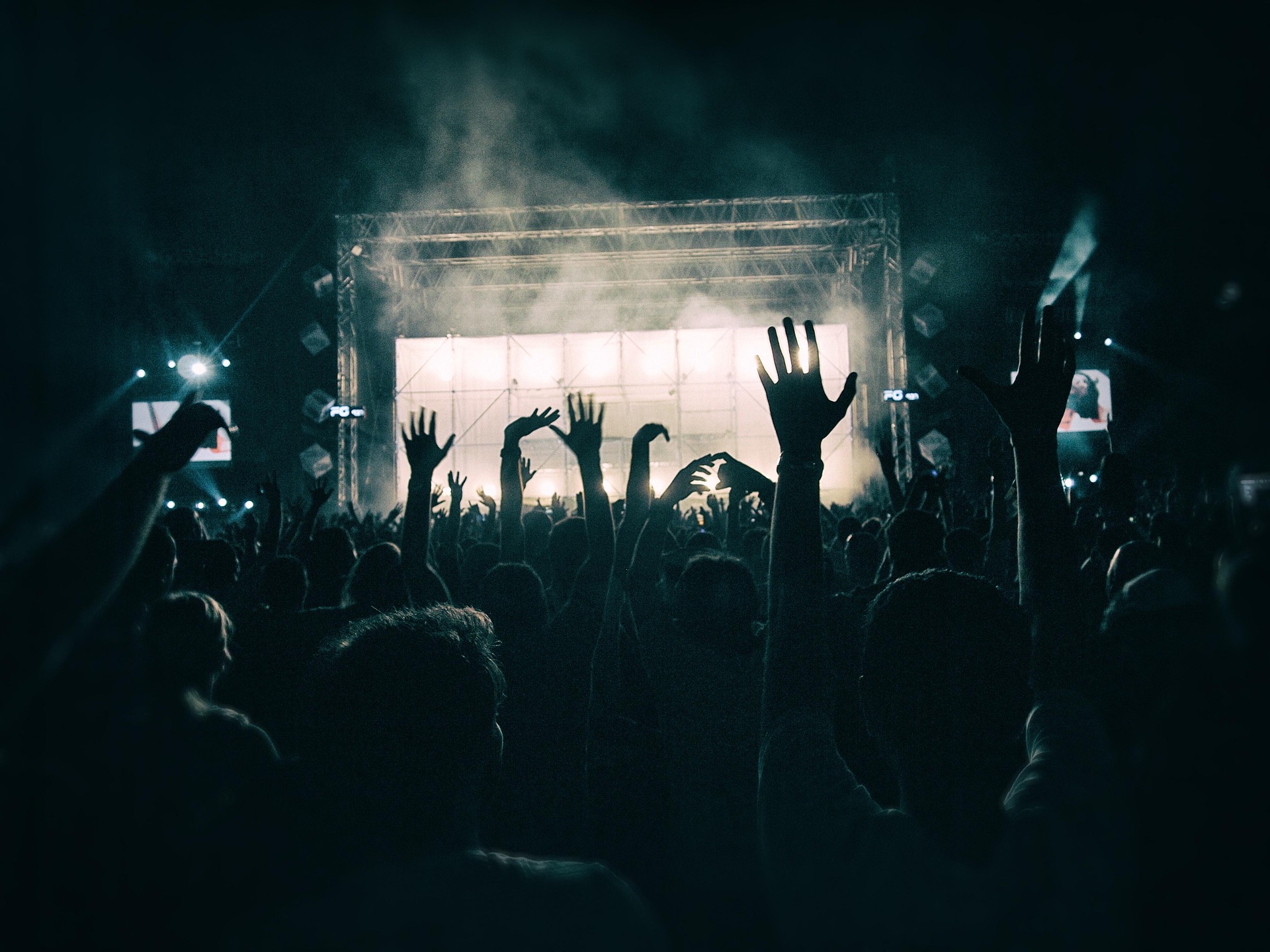 Friends meeting up at a concert venue